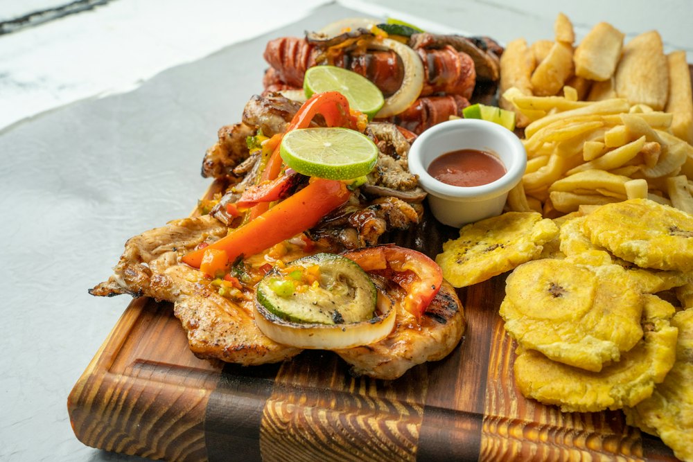 Stock photo of a Latin platter with meats and fried plantains